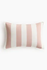 Almohadón lumbar a rayas rosa y crema